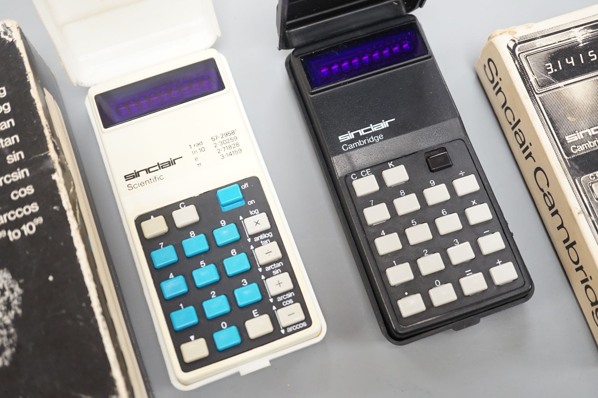 Two vintage Sinclair calculators, boxed